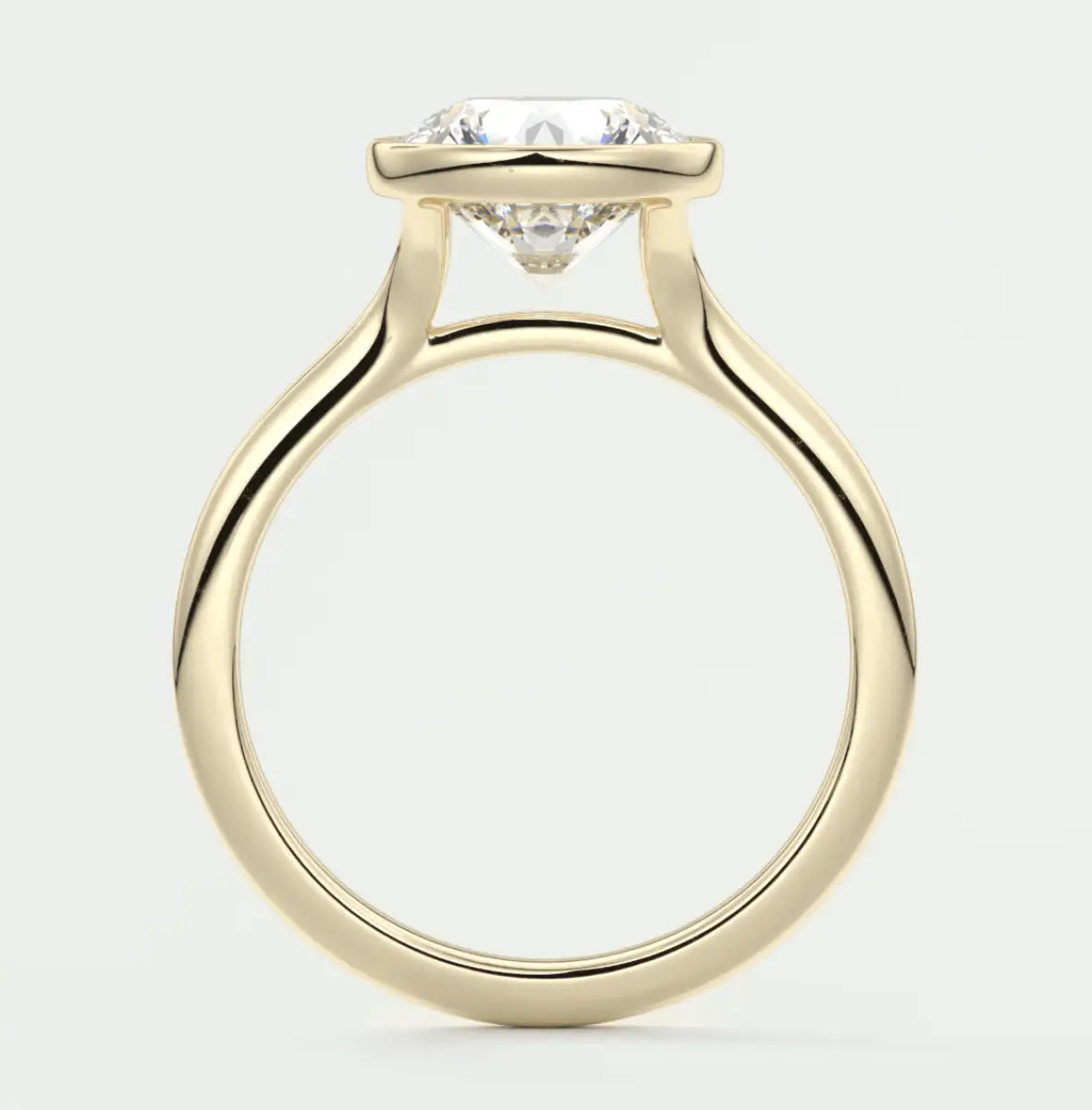 18-karat yellow gold solitaire engagement ring with a round diamond.
