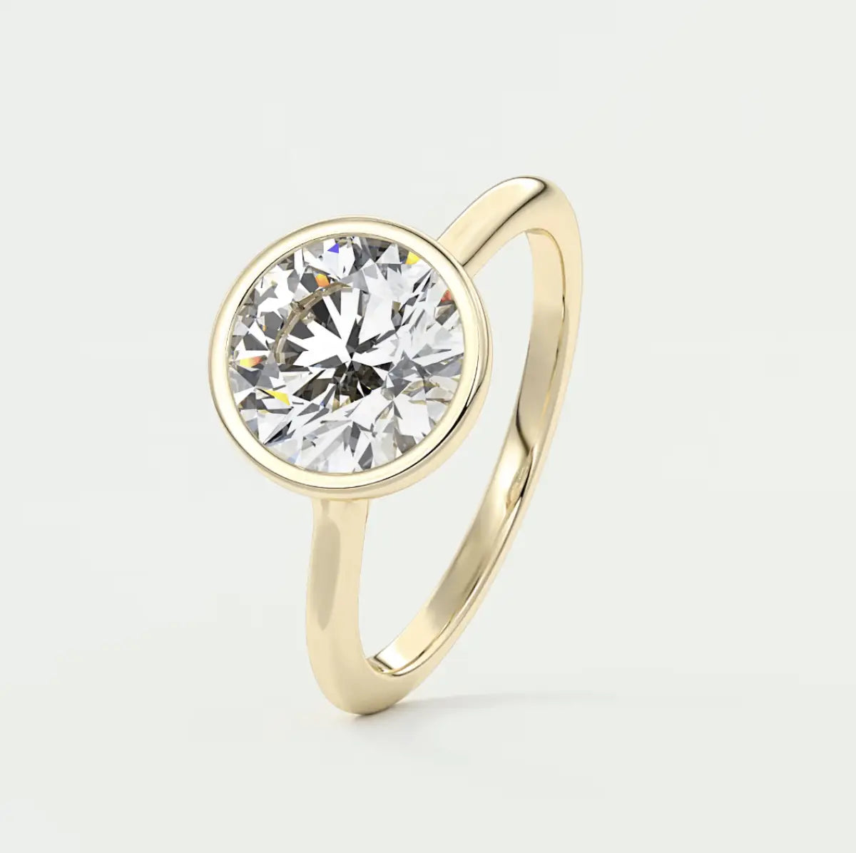 18-karat yellow gold solitaire diamond engagement ring.