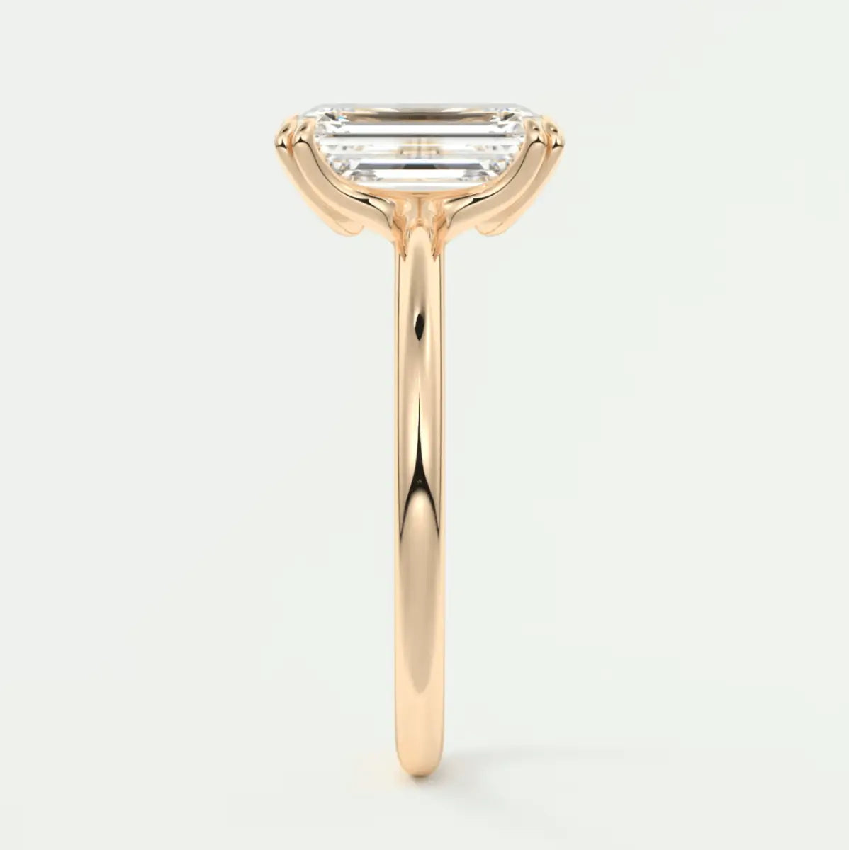 18k yellow gold emerald cut diamond engagement ring.
