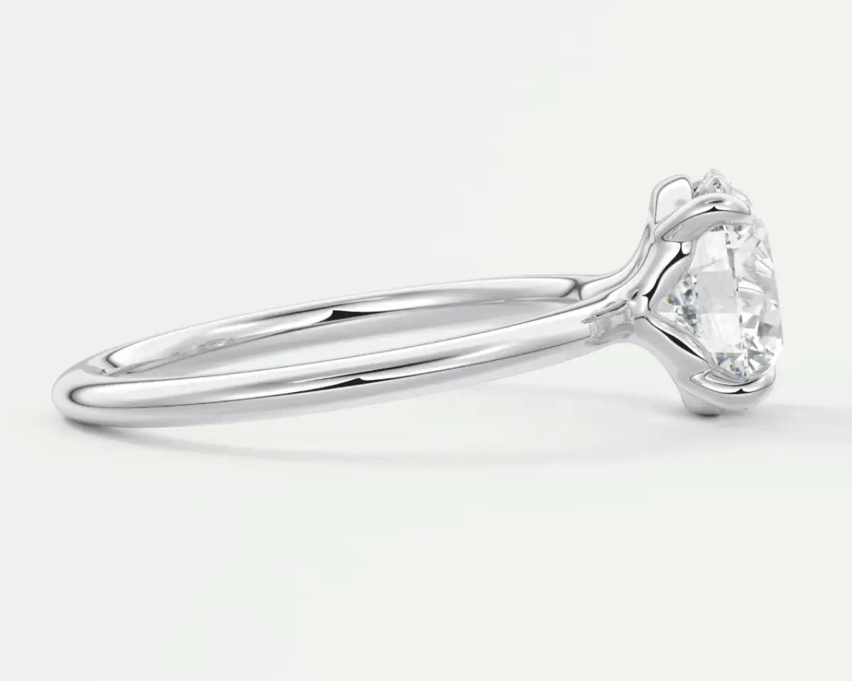 18-karat white gold solitaire diamond engagement ring.