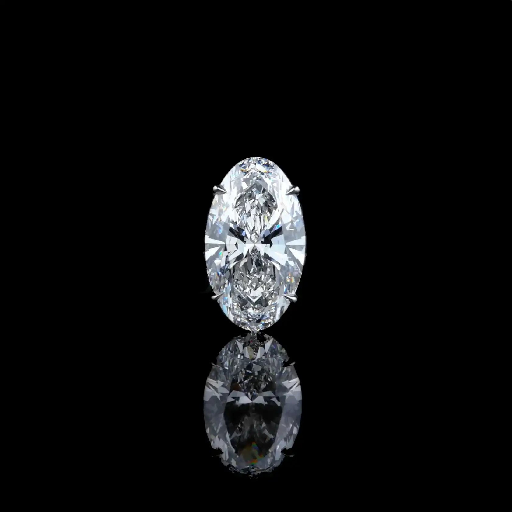 A radiant oval-cut diamond, brilliantly faceted and set in a sleek metallic prong setting.