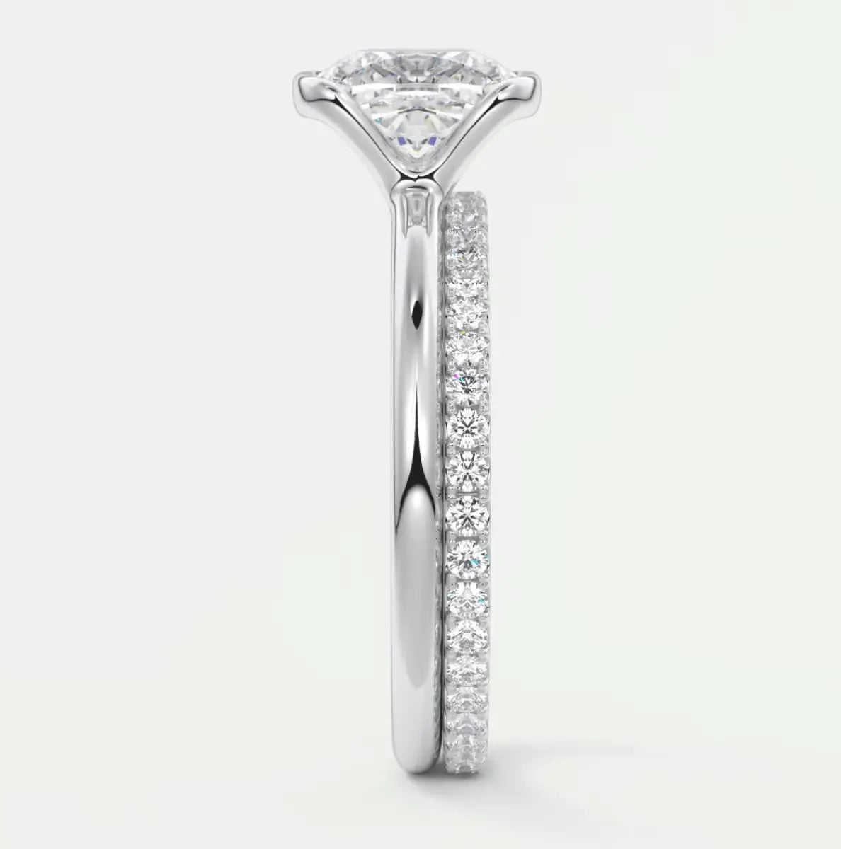 18k white gold princess cut diamond engagement ring with a matching band.