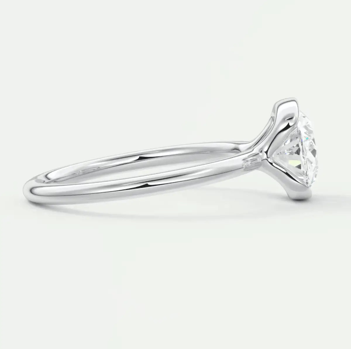 18k white gold solitaire engagement ring with a round diamond.
