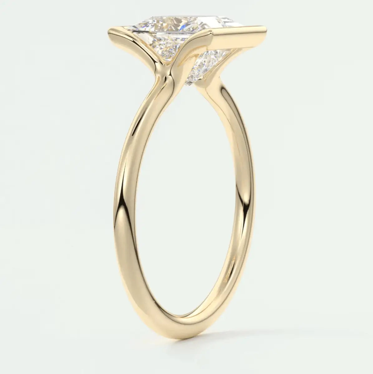 18k yellow gold engagement ring with a princess cut diamond.