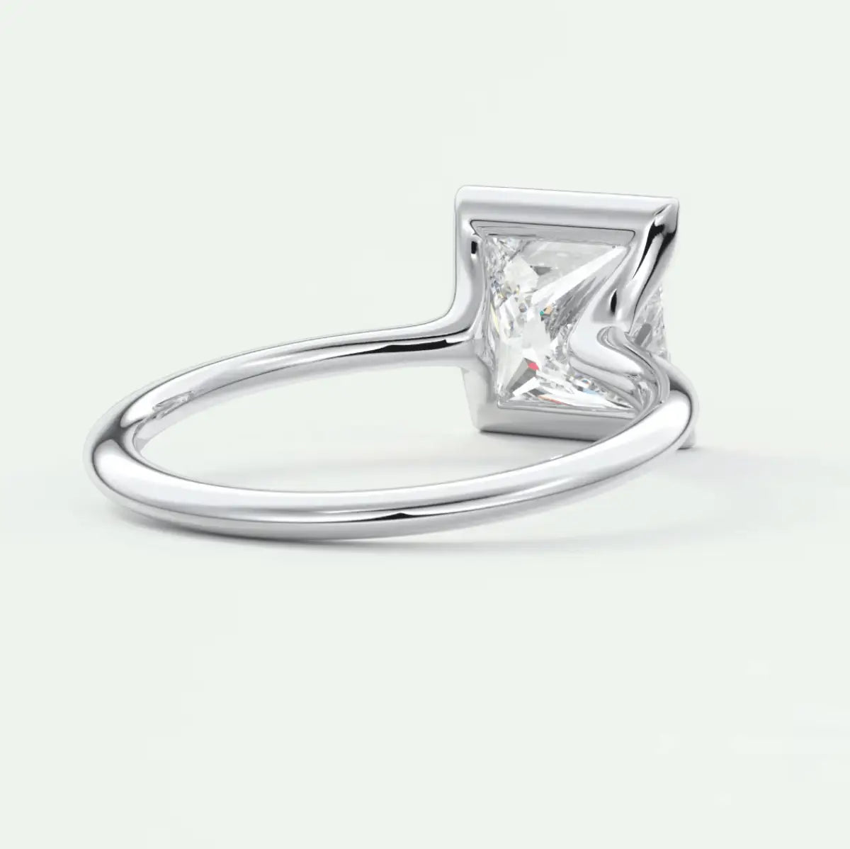 Princess cut diamond engagement ring with silver band.