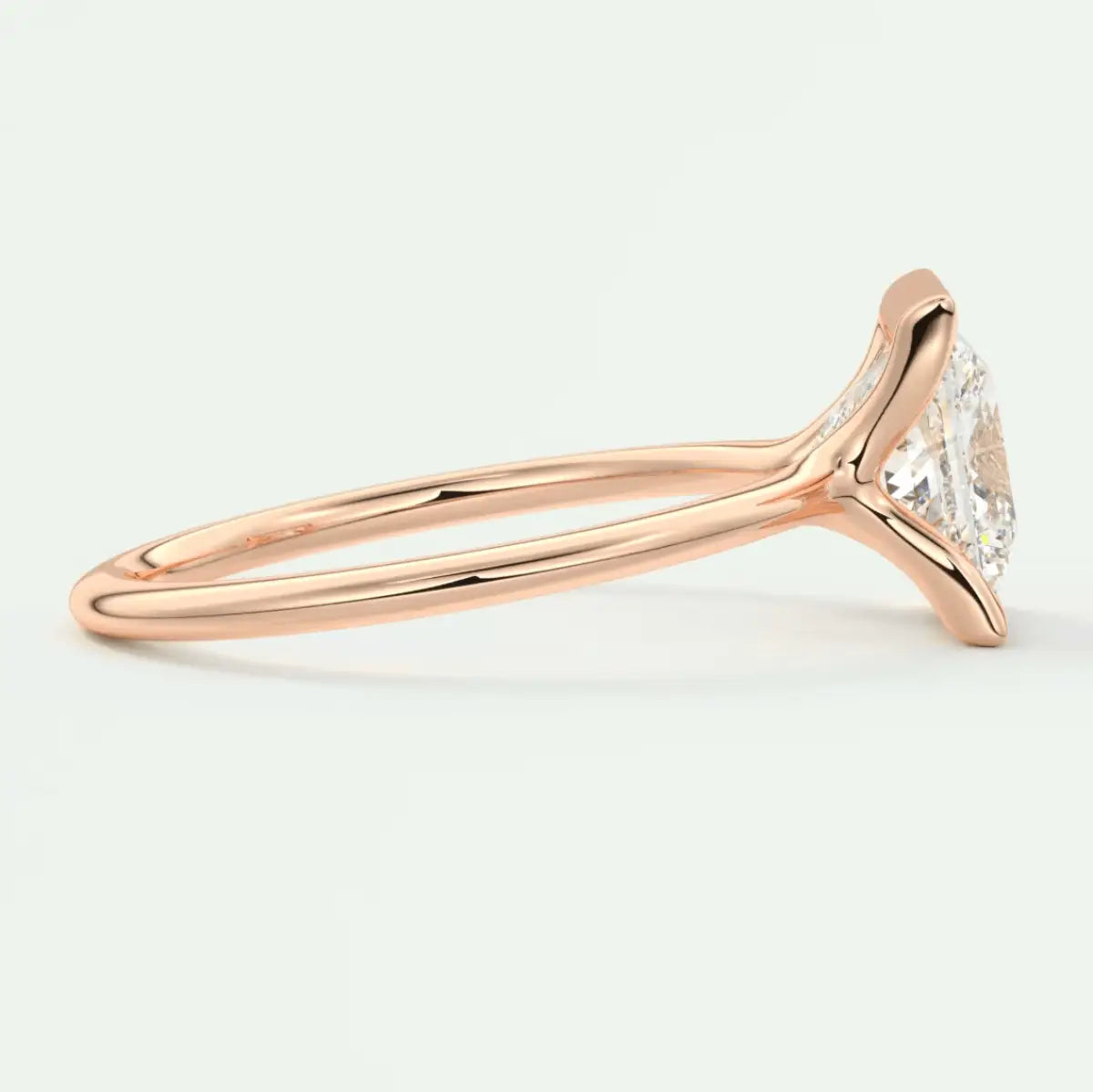 18-karat rose gold engagement ring with a marquise-cut diamond.