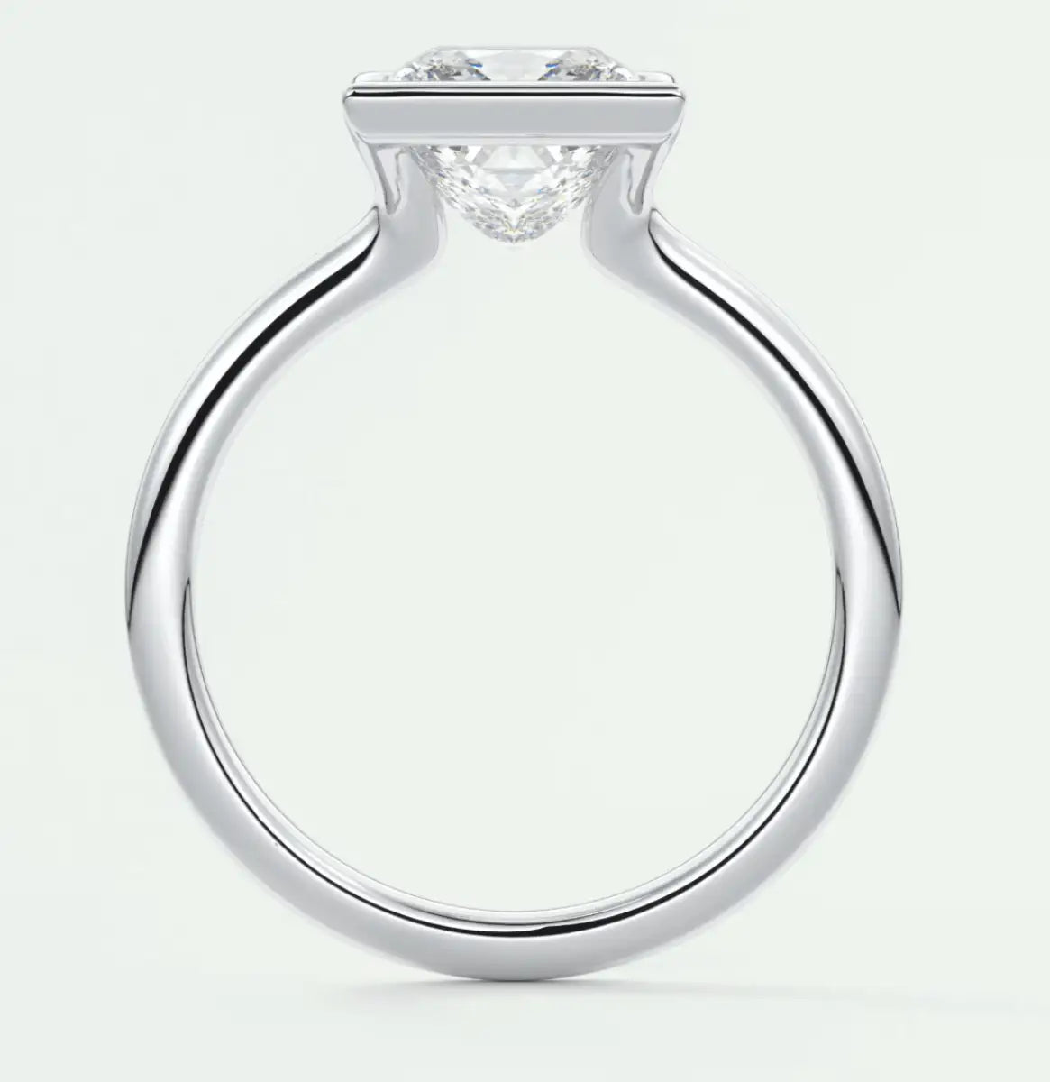 18k white gold diamond engagement ring with a princess cut center stone and two side stones.
