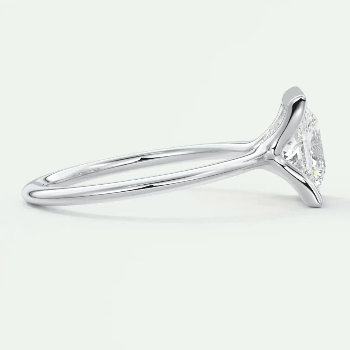 18-karat white gold engagement ring with a marquise-cut diamond.