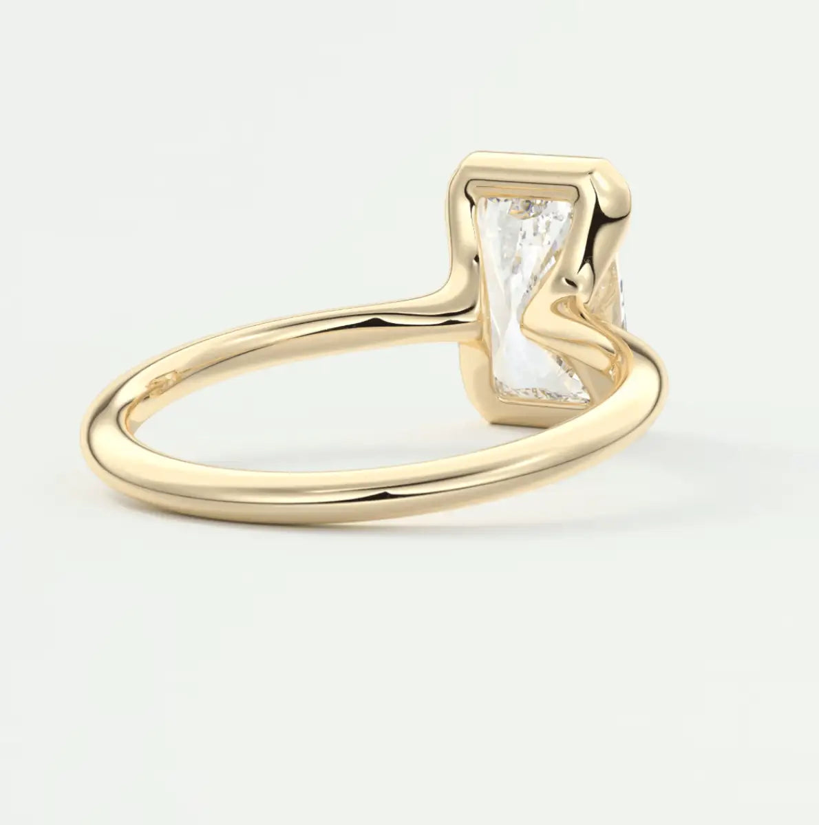 18k gold rectangular diamond engagement ring with a unique wavy cut.