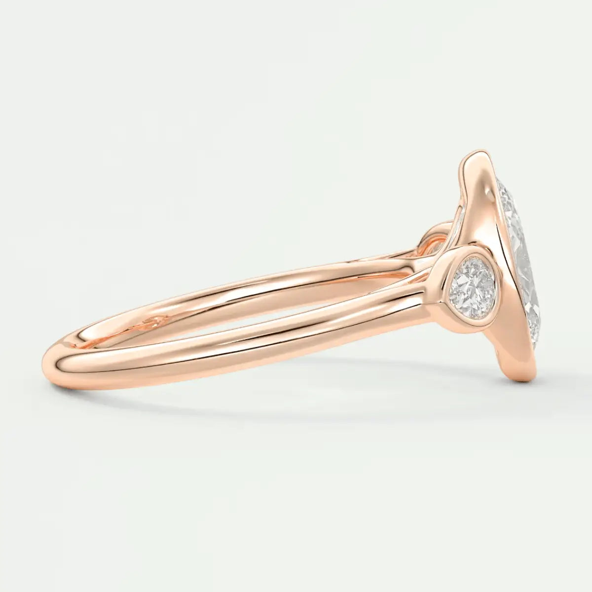 Rose gold diamond engagement ring with a halo design and round-cut center stone.