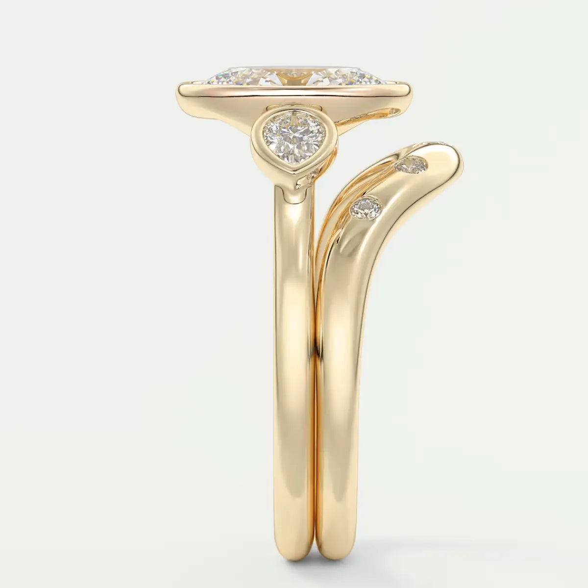 18-karat yellow gold engagement ring with a cushion-cut diamond center stone and small round diamonds on the band.