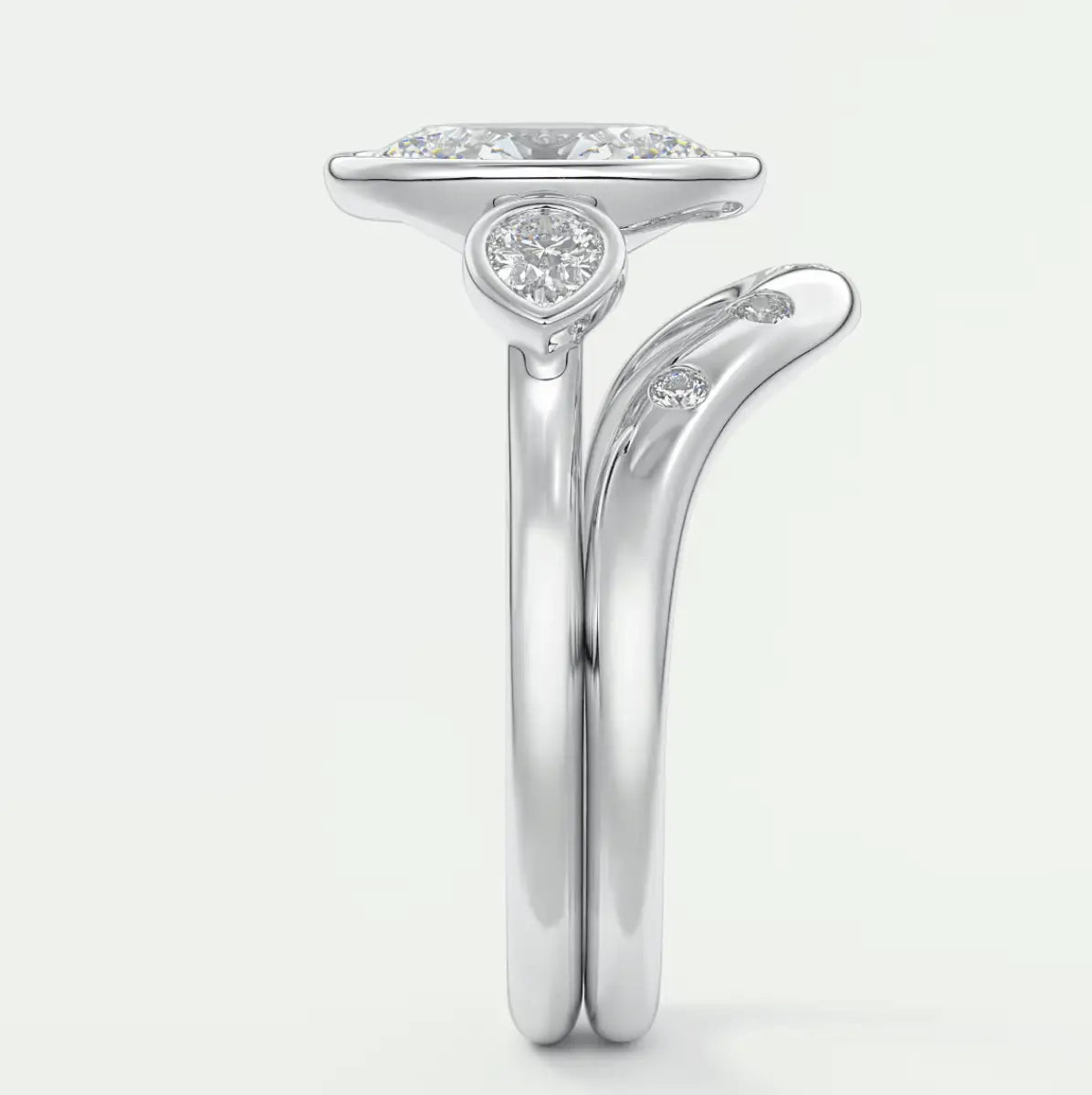18k white gold engagement ring with a princess cut diamond and small round diamonds on the band.