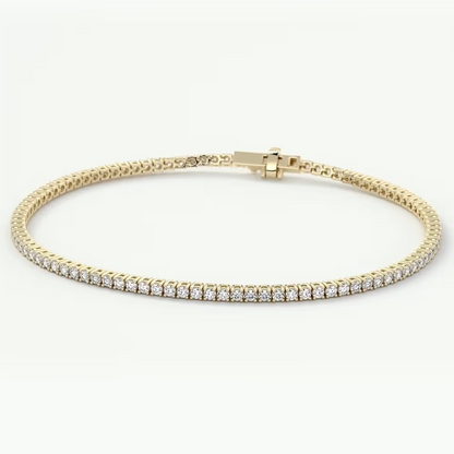 A yellow gold tennis bracelet with a row of clear round-cut gemstones, displayed on a clean white background.