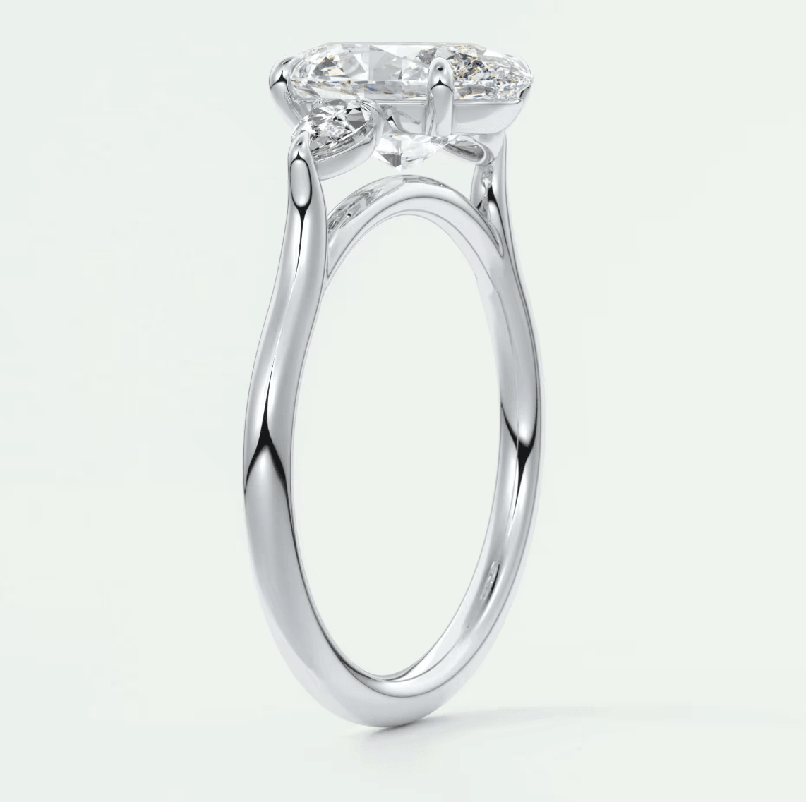 18-karat white gold engagement ring with a cushion-cut diamond.
