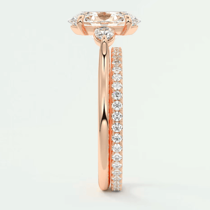 18-karat rose gold engagement ring with a marquise-cut diamond center stone and pavé set diamonds on the band.