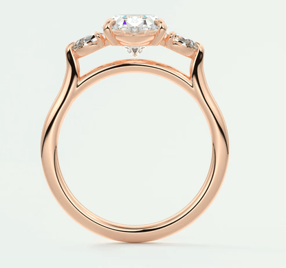 Rose gold engagement ring with a central diamond and smaller diamonds on the band, featuring an elegant marquise-cut gemstone.