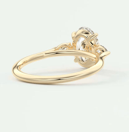 18k yellow gold engagement ring with a diamond center stone and small diamonds on the band.