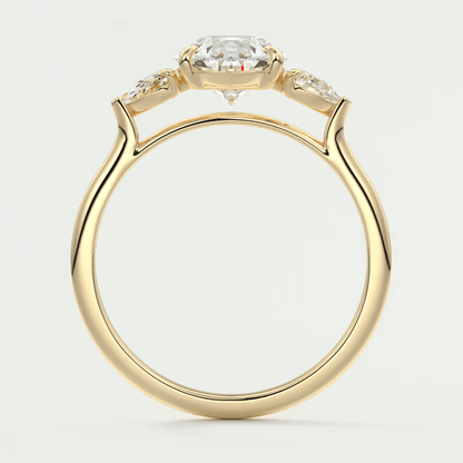 18-karat yellow gold engagement ring with a cushion-cut diamond and two smaller diamonds on either side.