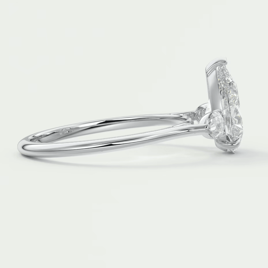 18k white gold diamond engagement ring with a marquise-cut center stone and halo of smaller diamonds.