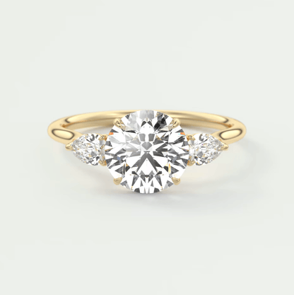 18k yellow gold engagement ring with three round diamonds.