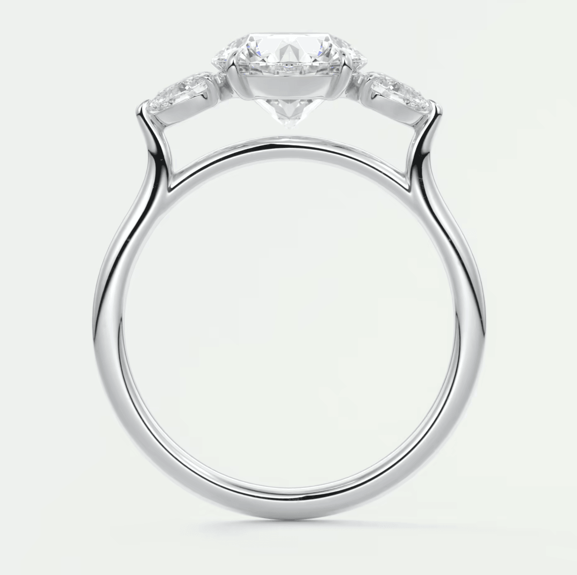 18k white gold engagement ring with three diamond stones.