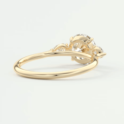 18k yellow gold engagement ring with a large, round diamond and intricate floral detailing.