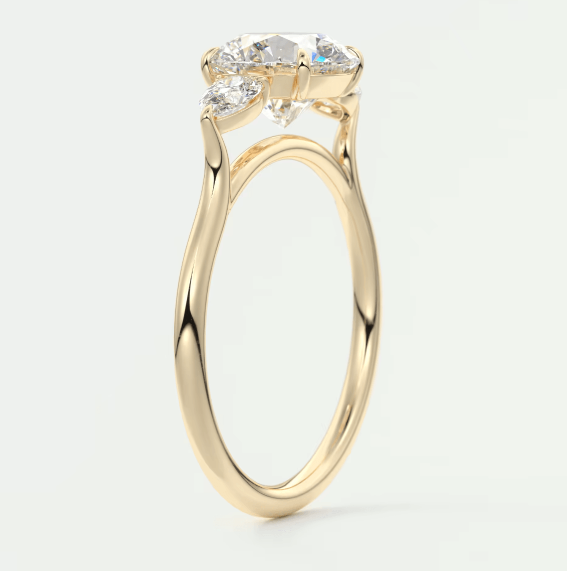 18k yellow gold engagement ring with three diamond stones.