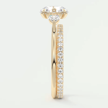 18k yellow gold diamond engagement ring with a heart-shaped halo and pave band.