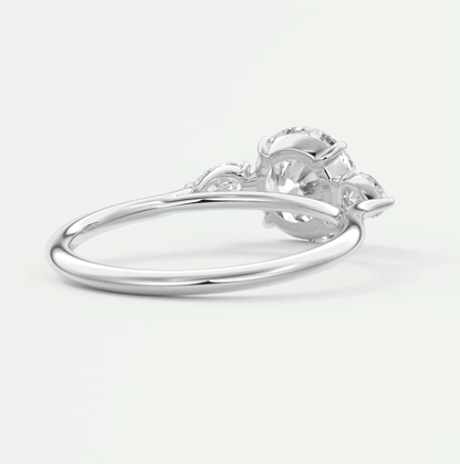Silver diamond engagement ring with floral design and claw setting.