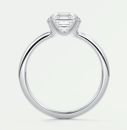 18-karat white gold engagement ring with an emerald-cut diamond.