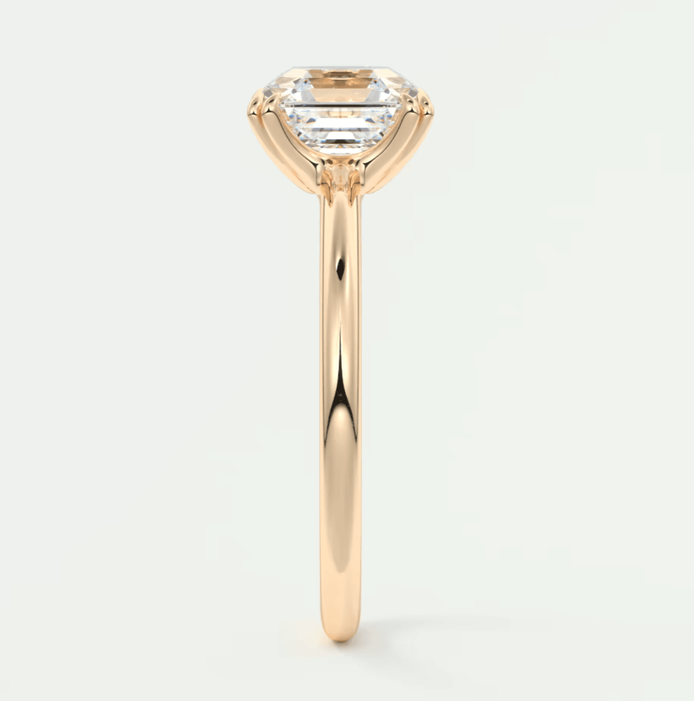 18k rose gold engagement ring with a princess cut diamond.