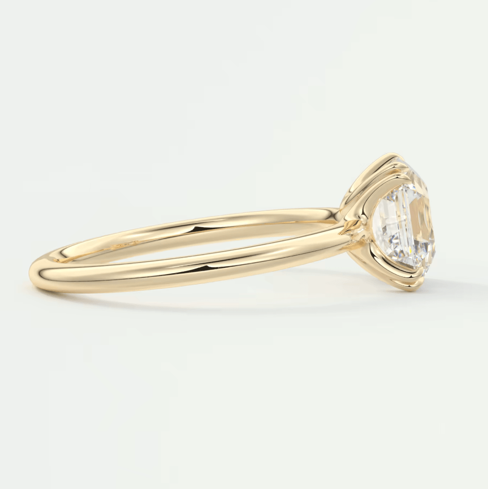 18k yellow gold engagement ring with a marquise-cut diamond.