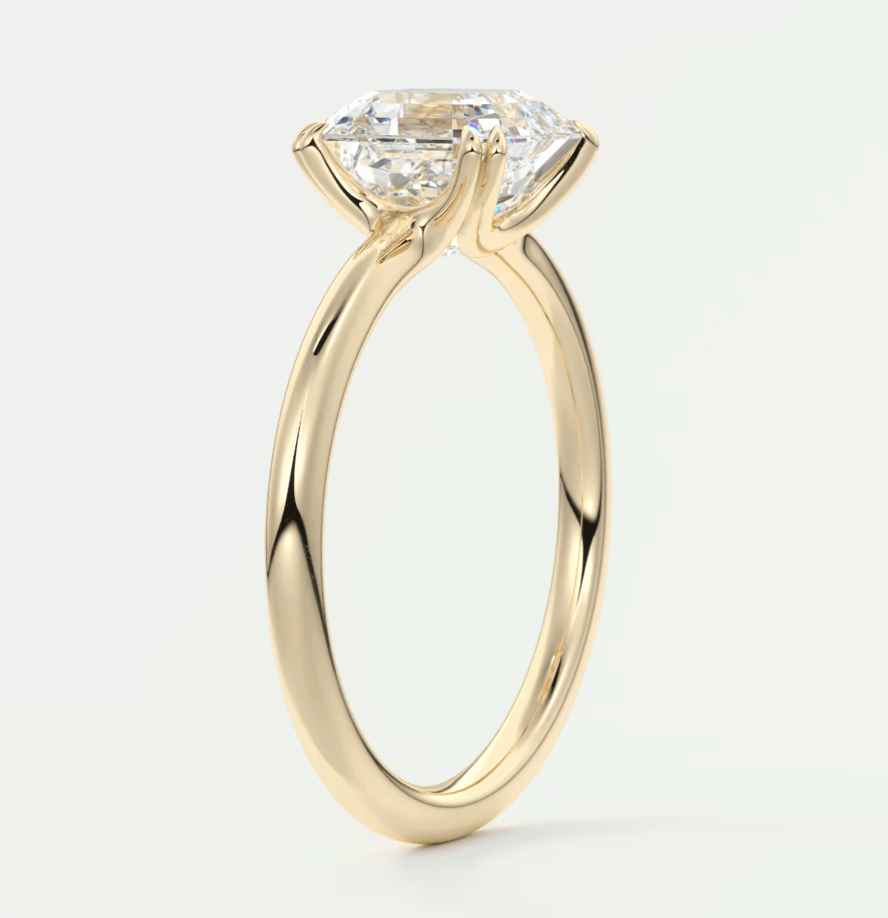18-karat yellow gold engagement ring with a princess-cut diamond.