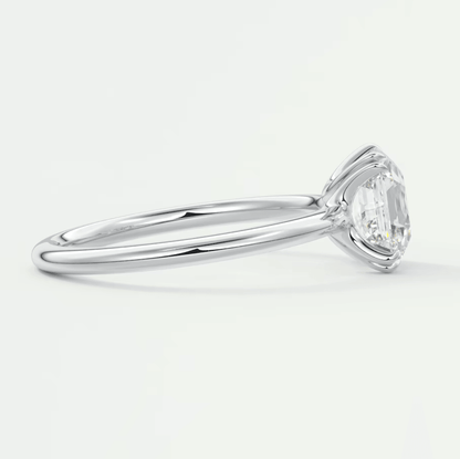 18-karat white gold engagement ring with a marquise-cut diamond.