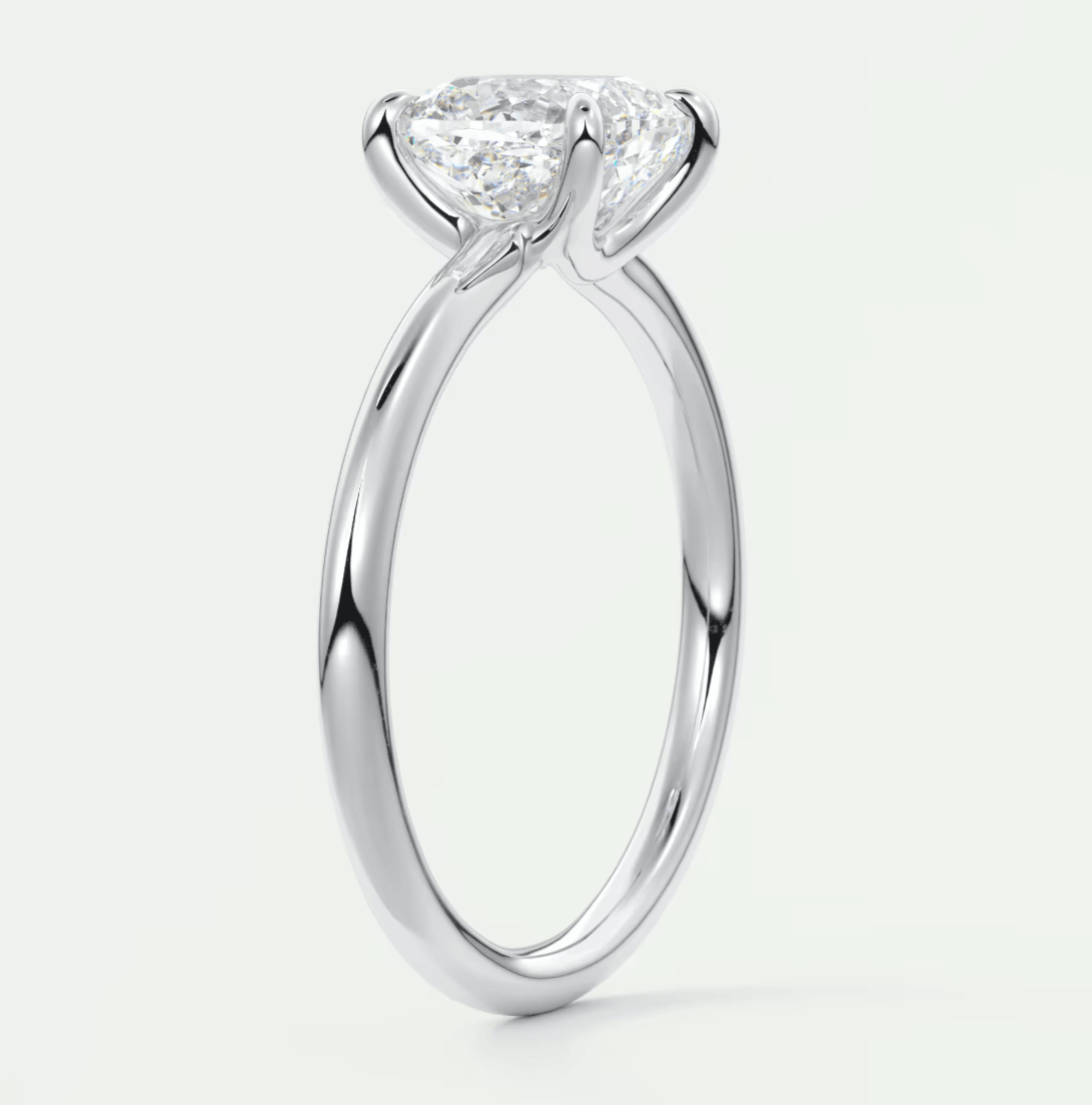 18k white gold solitaire diamond engagement ring with a princess cut stone.