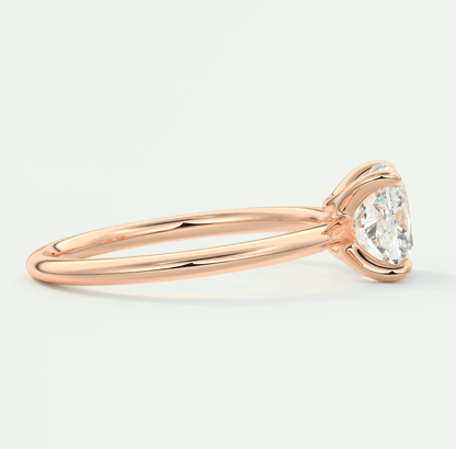 Rose gold diamond engagement ring with a solitaire design and prong setting.