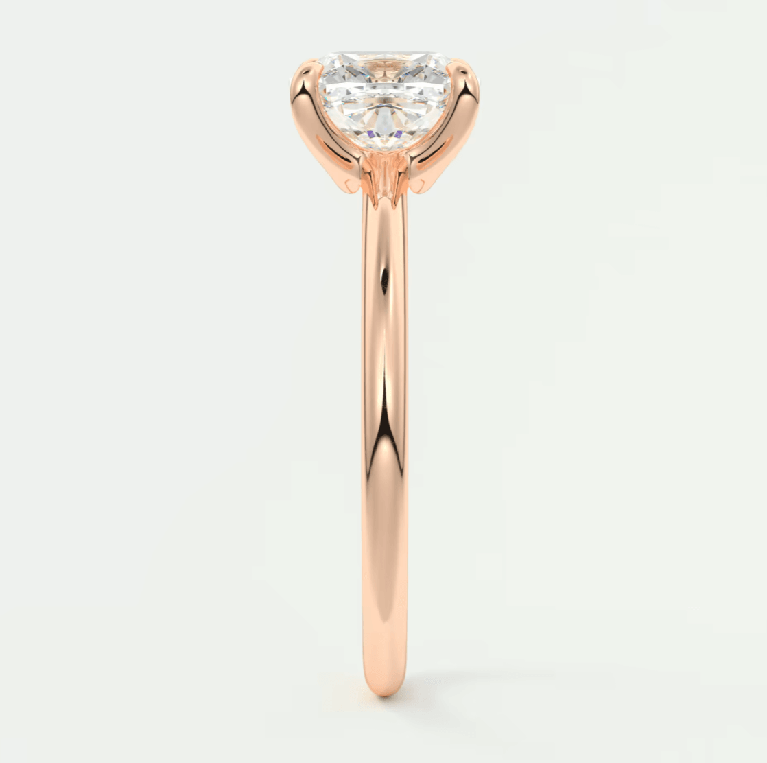 18-karat rose gold engagement ring with a heart-shaped diamond.