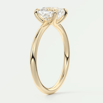 18k yellow gold engagement ring with a pear-shaped diamond.