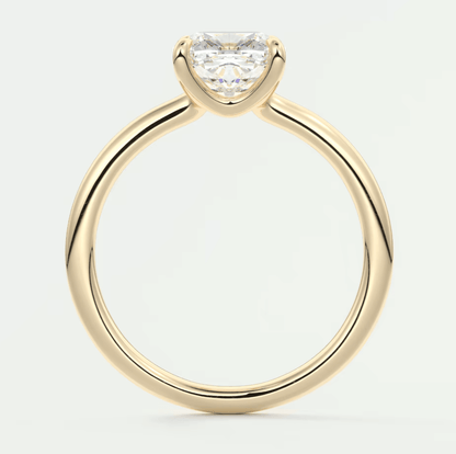 18k yellow gold solitaire engagement ring with a princess cut diamond.