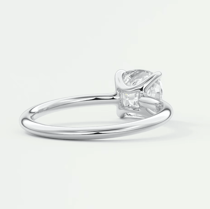 Silver princess cut diamond engagement ring with a sleek band and claw setting.