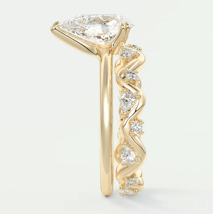 18k yellow gold engagement ring with a princess cut diamond and small diamonds set in the band.
