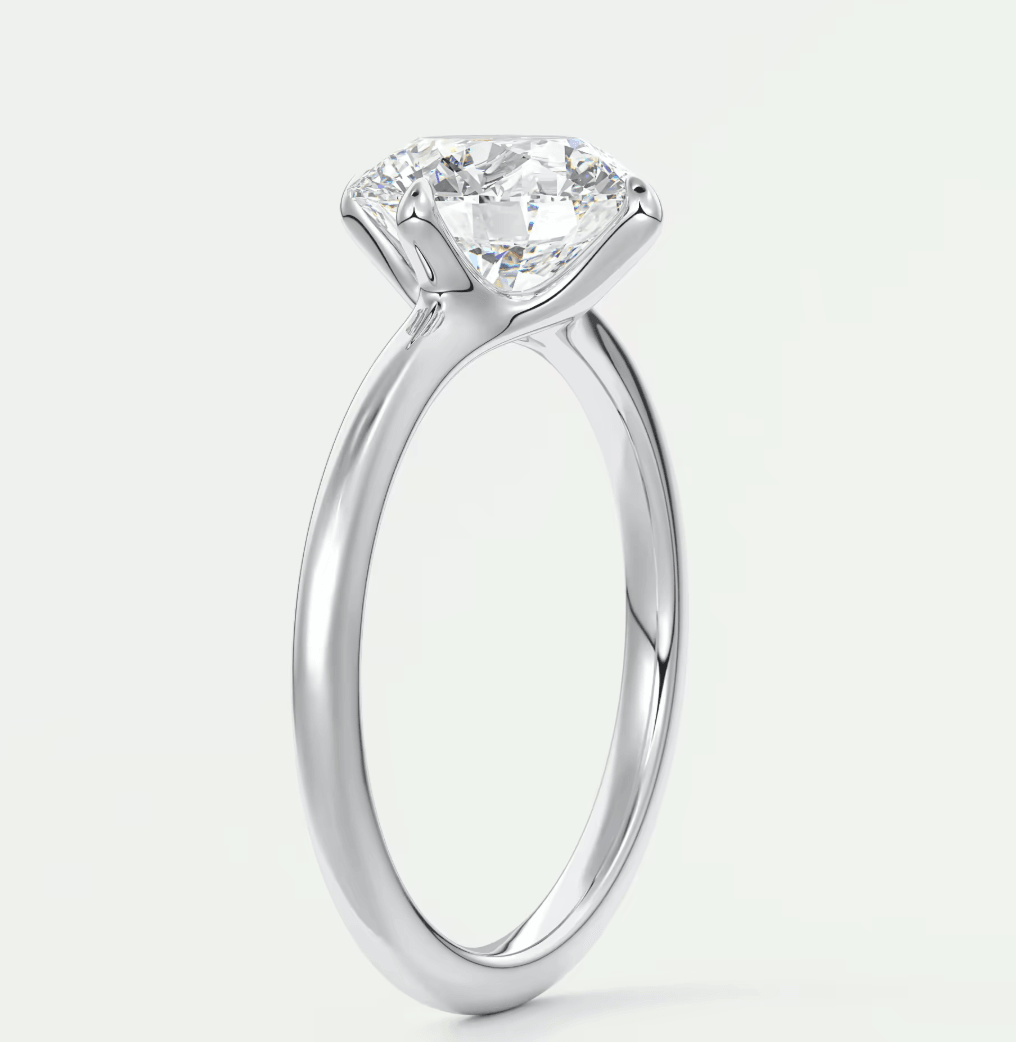 18-karat white gold solitaire diamond engagement ring.