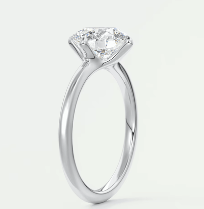 18-karat white gold solitaire diamond engagement ring.
