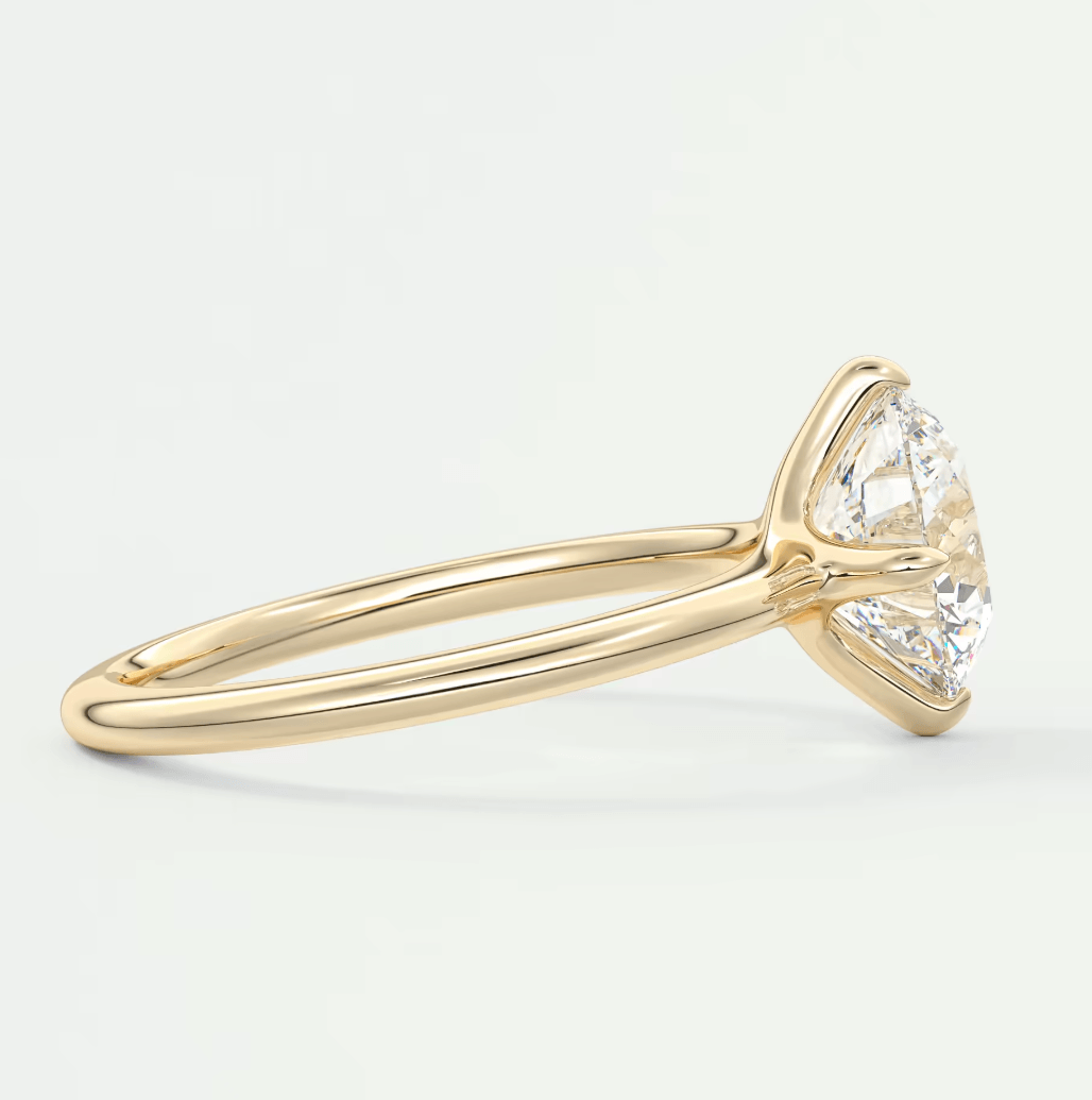 18k yellow gold engagement ring with a marquise-cut diamond.