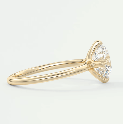 18k yellow gold engagement ring with a marquise-cut diamond.