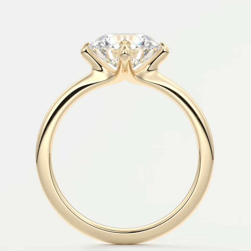 18-karat yellow gold solitaire engagement ring with a princess-cut diamond.