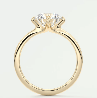 18-karat yellow gold solitaire engagement ring with a princess-cut diamond.