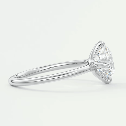18-karat white gold engagement ring with a marquise-cut diamond.