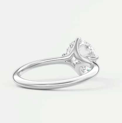 18-karat white gold engagement ring with a marquise-cut diamond.