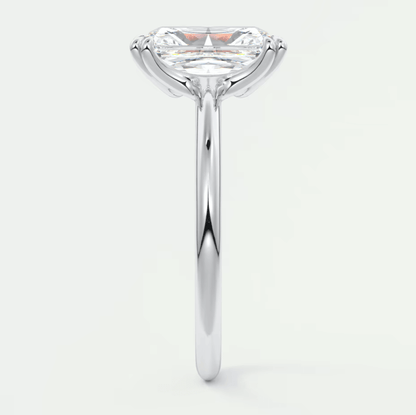18-karat white gold solitaire engagement ring with a princess-cut diamond.